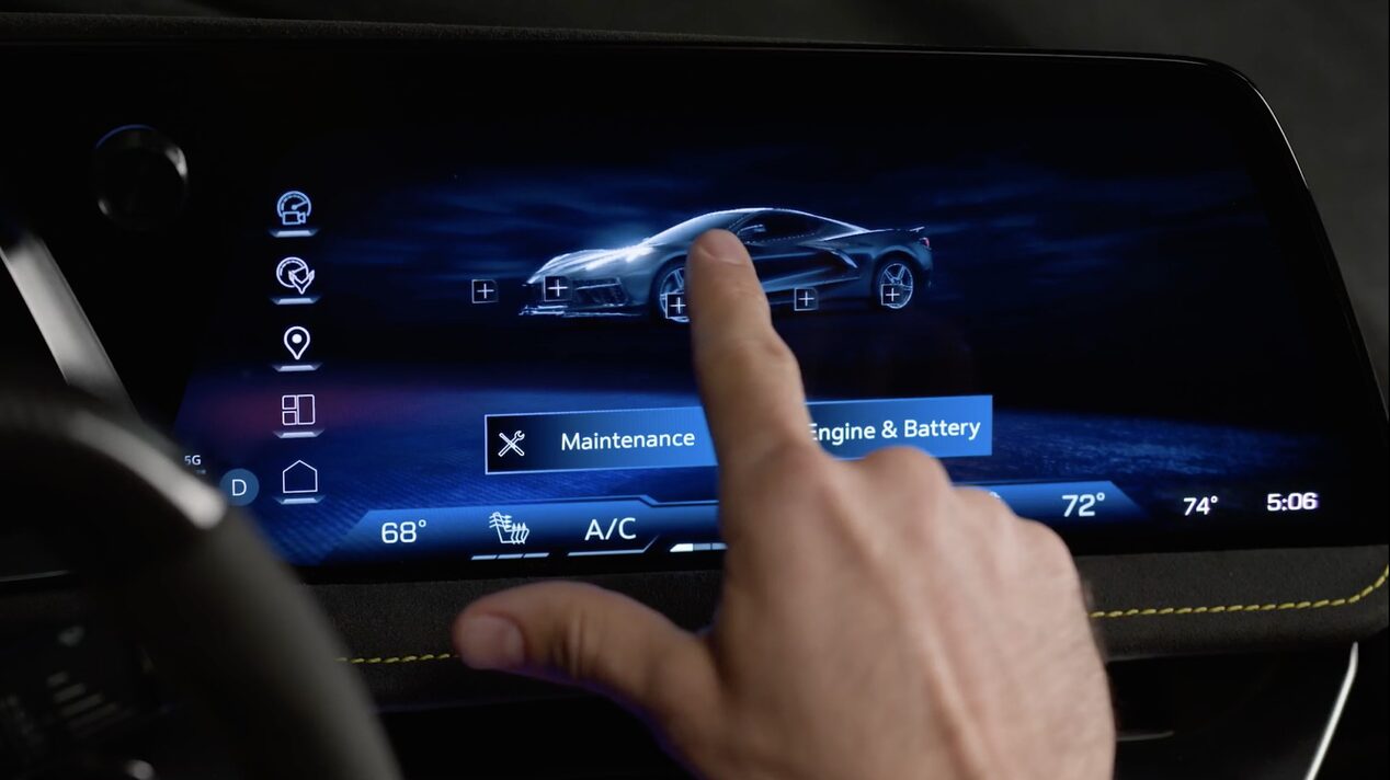 A Hand Touching the Digital Infotainment Screen Inside a Chevy Corvette Displaying a Vehicle Settings Menu.
