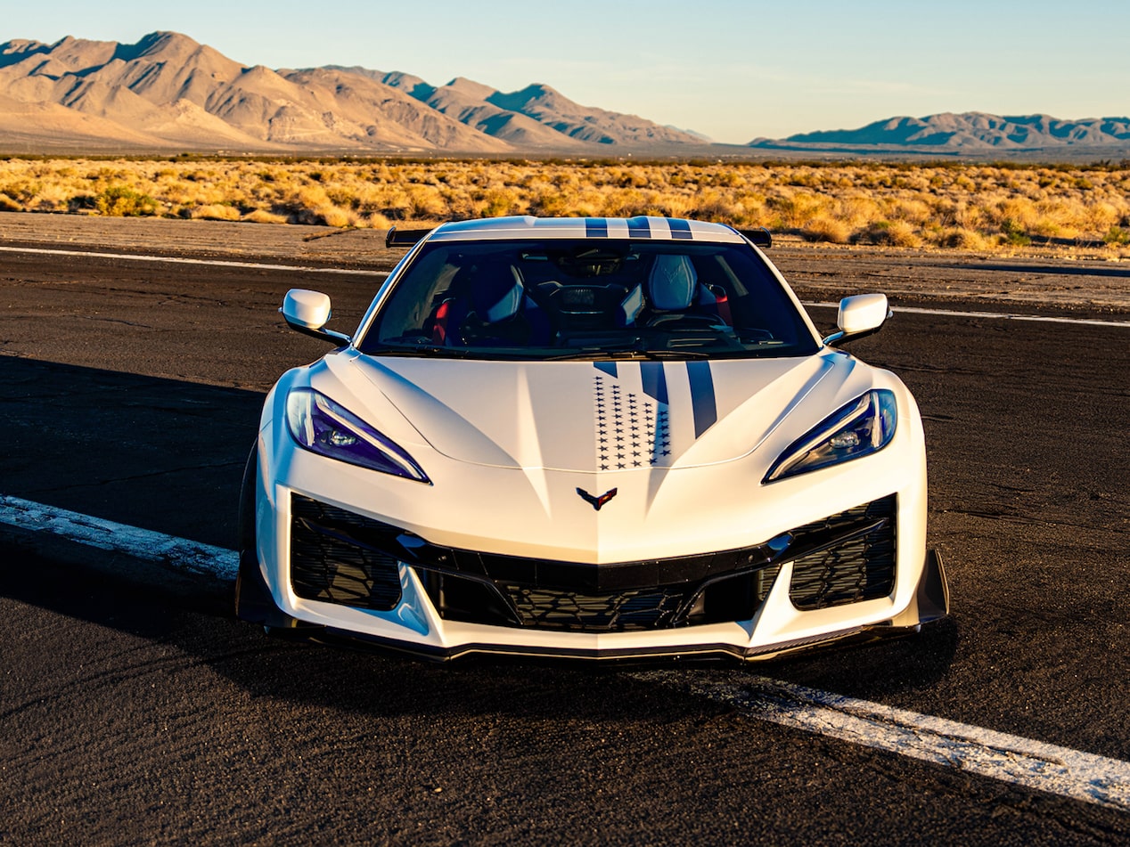 Front View of a White Chevy Corvette Parked on a Road.