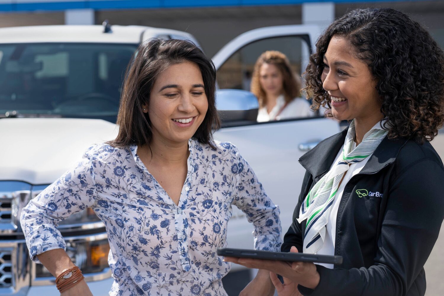 A CarBravo Sales Woman Helping a Customer Find Her Perfect Chevy Vehicle