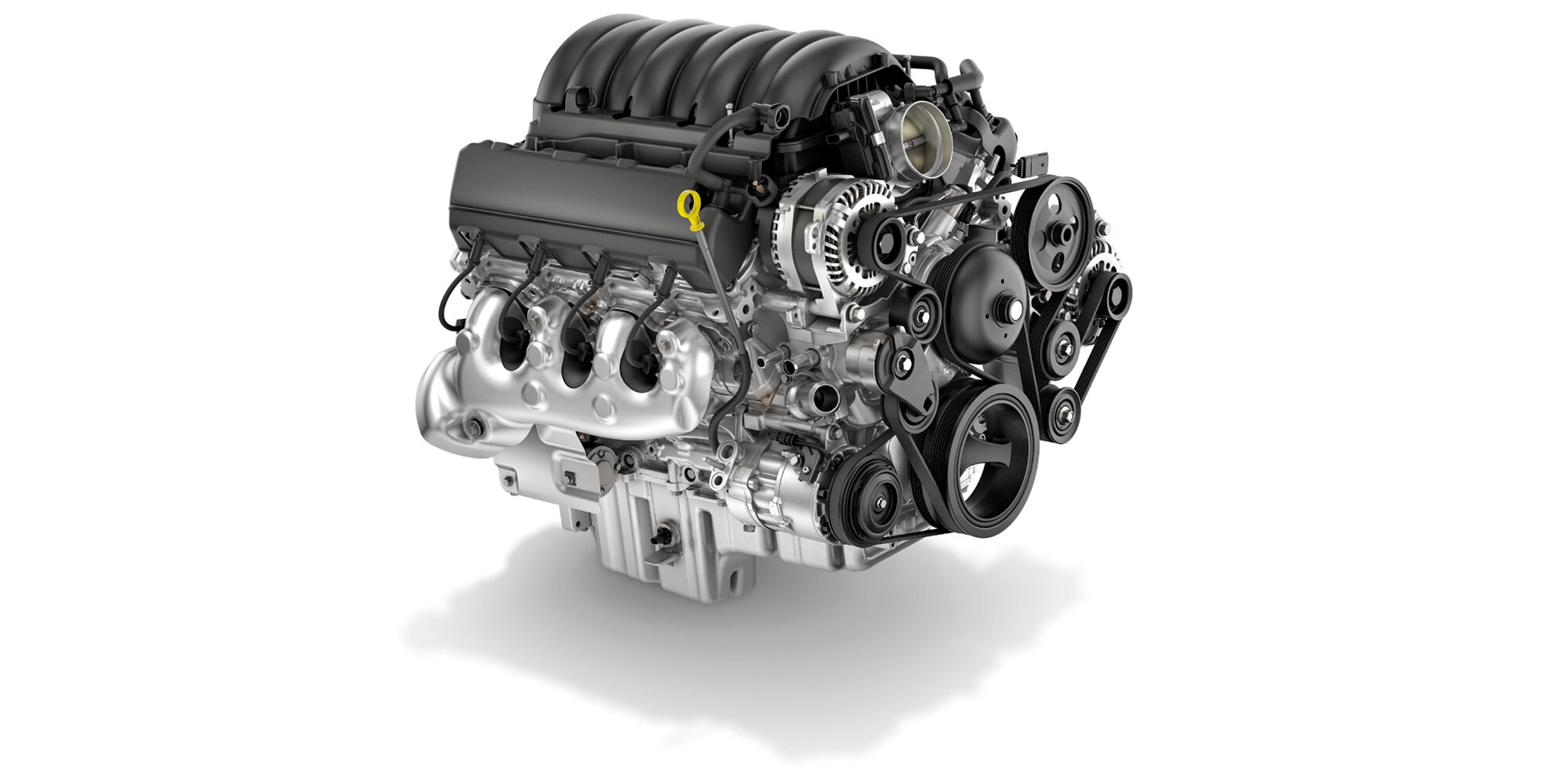 A Detailed View of a Modern V8 Engine, Featuring its Intake Manifold, Serpentine Belt System, and Various Components.