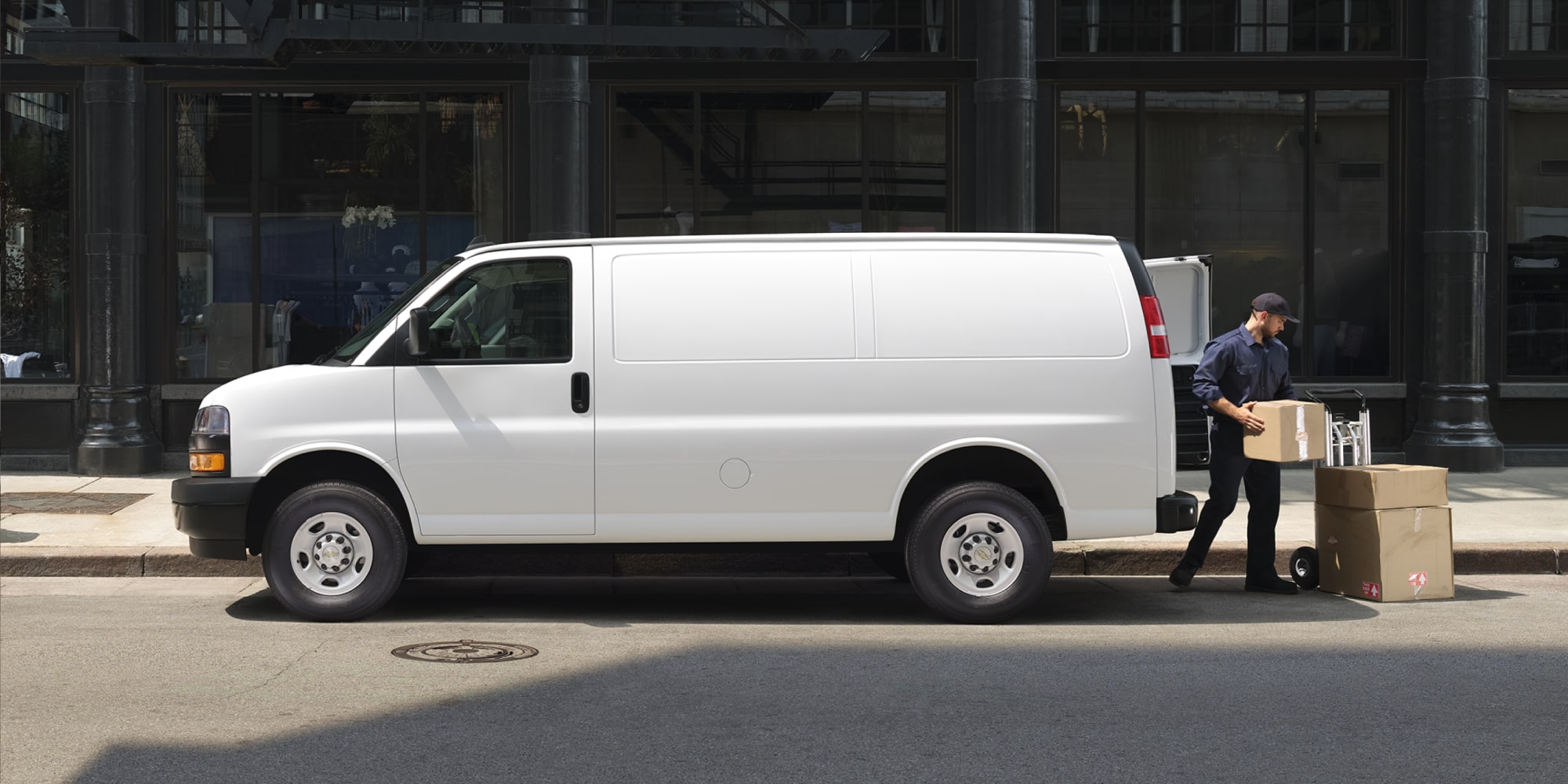 Man Unloading Boxes From His 2026 Chevy Express Cargo Van
