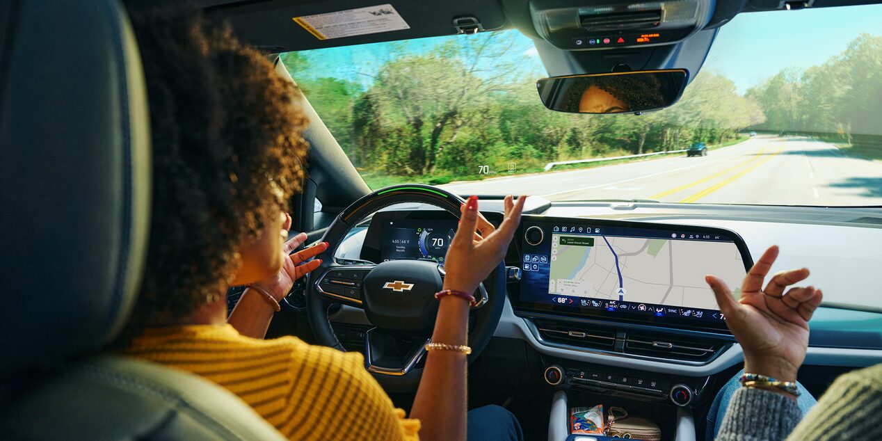Woman Using Super Cruise  Hands Free Driving Feature