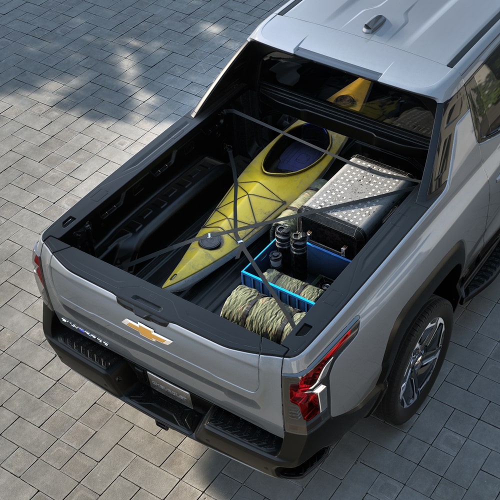 Kayak and Camping Gear Stored in the Bed of a 2026 Chevy Silverado EV