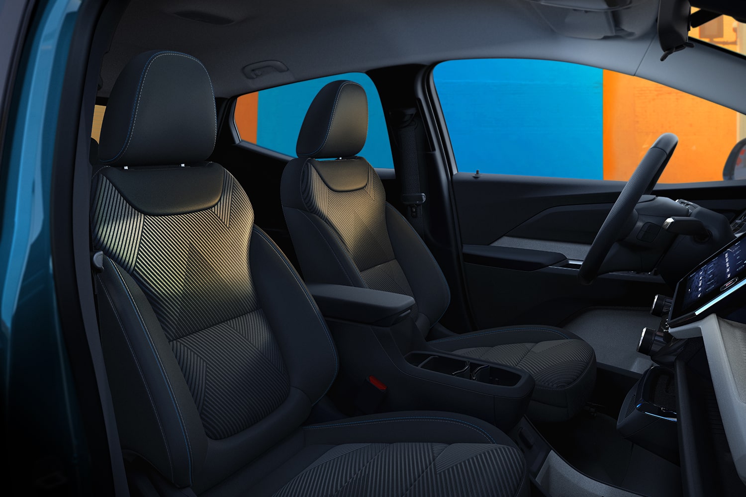 The Front Interior of a 2027 Chevrolet Bolt Shows the Black and Gray Cloth Front Seats and the Center Armrest with a Storage Compartment.