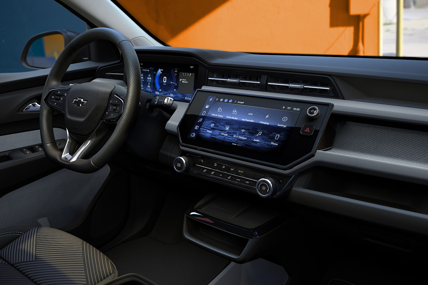 The Interior of a 2027 Chevrolet Bolt Shows the Dashboard, with a Full View of the Digital Infotainment Screen and Climate Control Buttons.