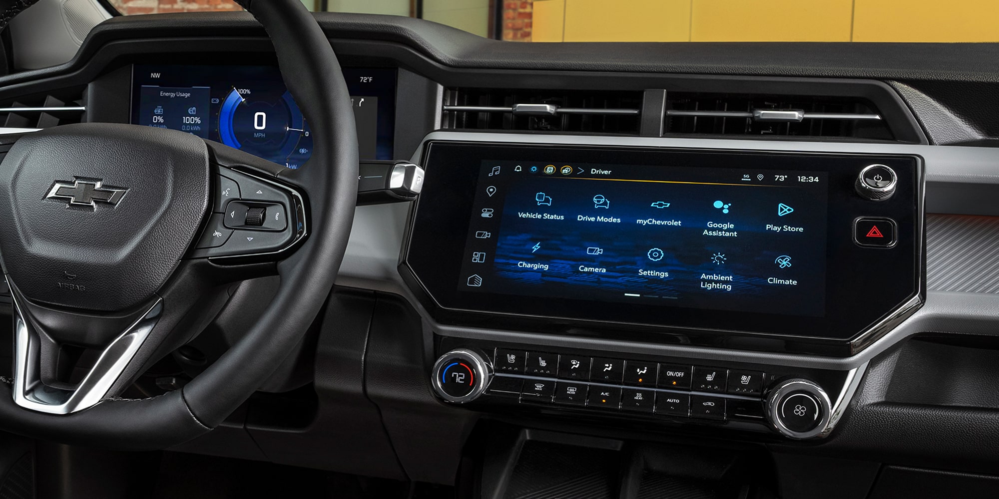 The Interior of a 2027 Chevrolet Bolt Showing the Driver's Perspective of the Digital Dashboard and the Infotainment Screen Displaying App Icons.