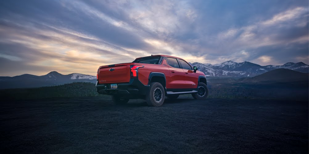 2026 Chevy Silverado Driving Through a Scenic Landscape During Sunset or Sunrise