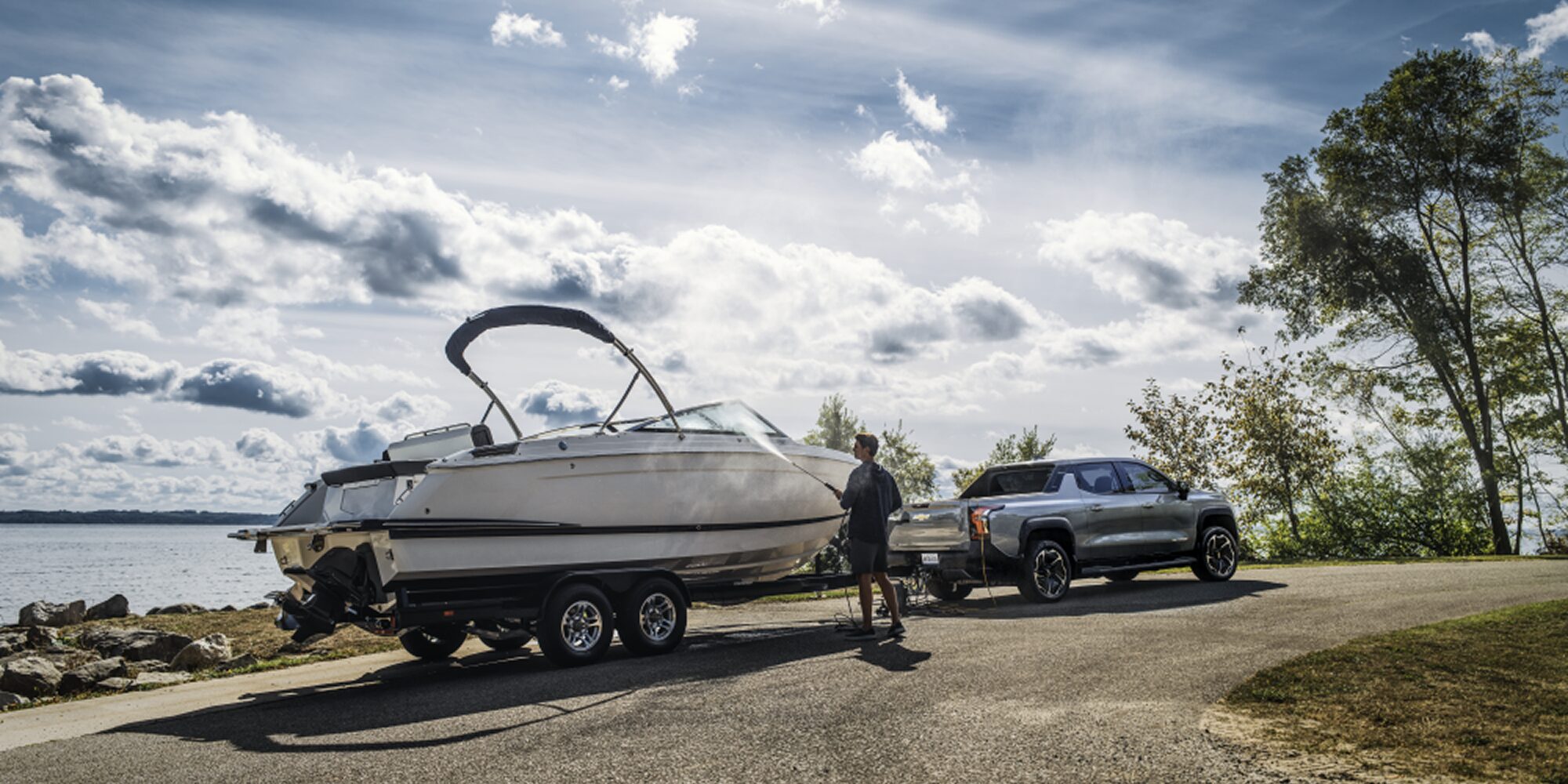 2026 Chevy Silverado Towing a Boat on a Trailer Highlighting its Towing Capability