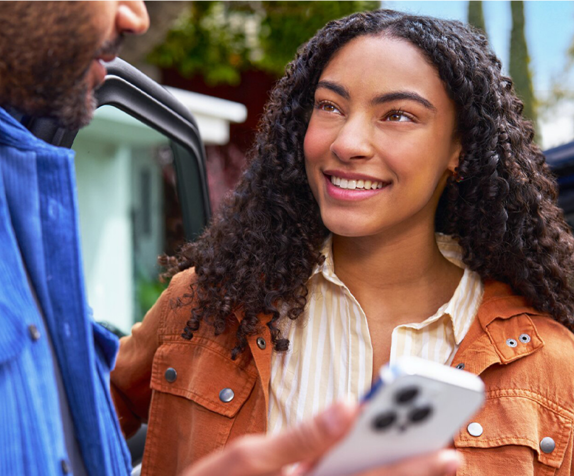 Couple Using the MyChevrolet App on Their Smartphone
