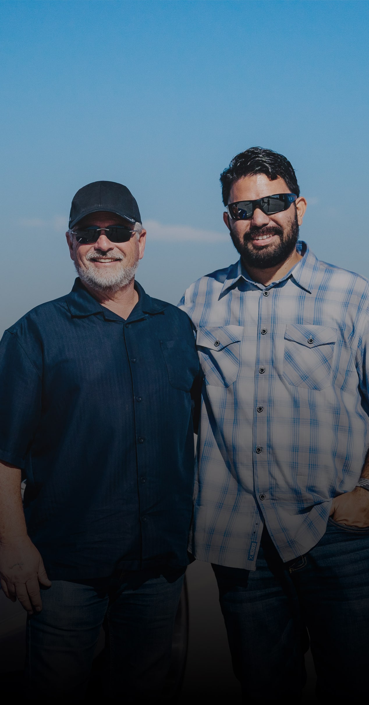 A Person Wearing a Dark Shirt Standing Beside Another Person Wearing a Light Plaid Shirt with Visible Text That Reads We Dropped That LT4 In and Had Nothing but Enjoyment Above the Name Mark Allen and 1967 Chevrolet Camaro RS/SS.