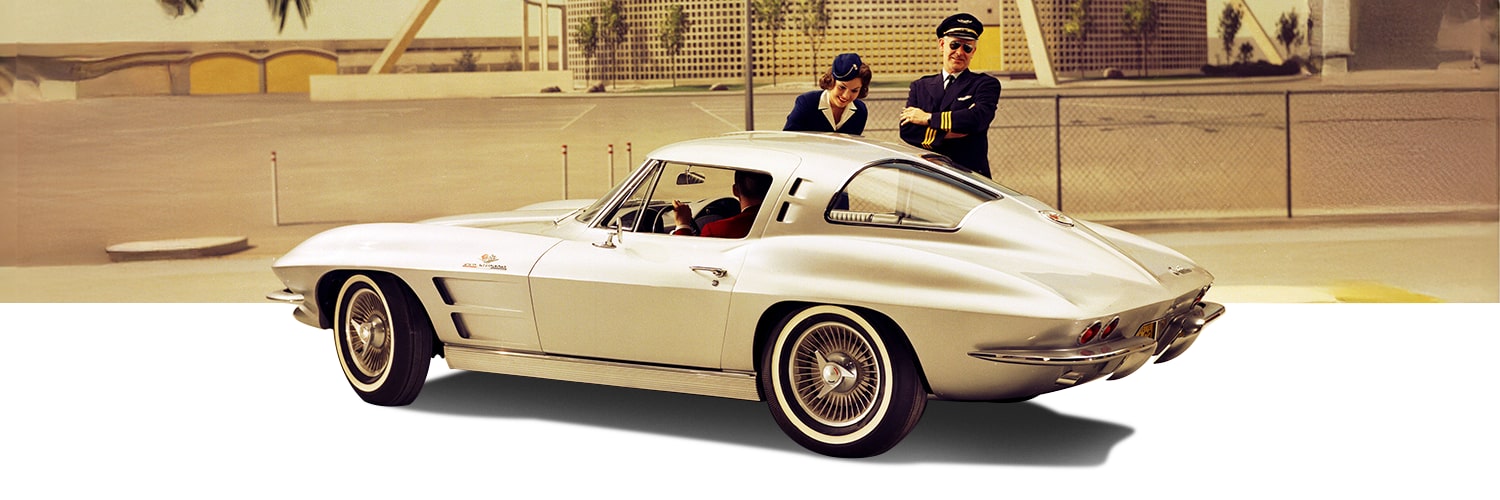 Classic White Chevrolet Corvette Sting Ray Rear Three-Quarter View with Driver, with a Pilot and Flight Attended Next to It