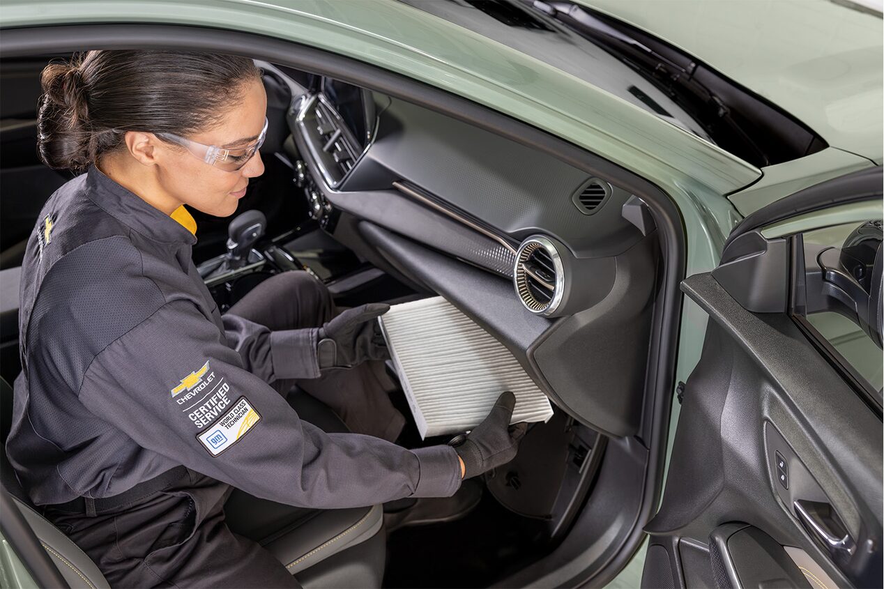 A Mechanic Changing the Filter on the Front Passenger Side