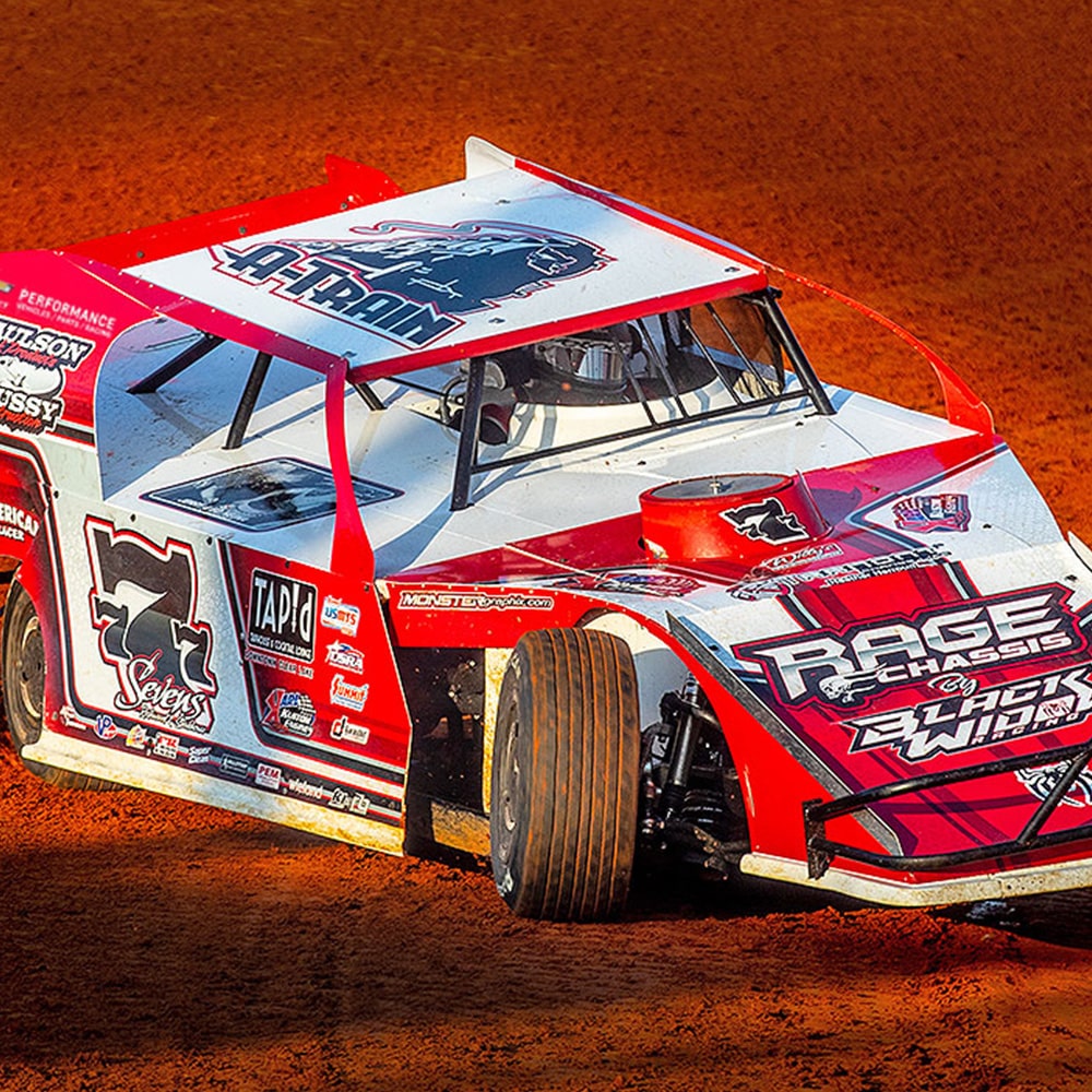 Red Racing Vehicle on the Speedway Track