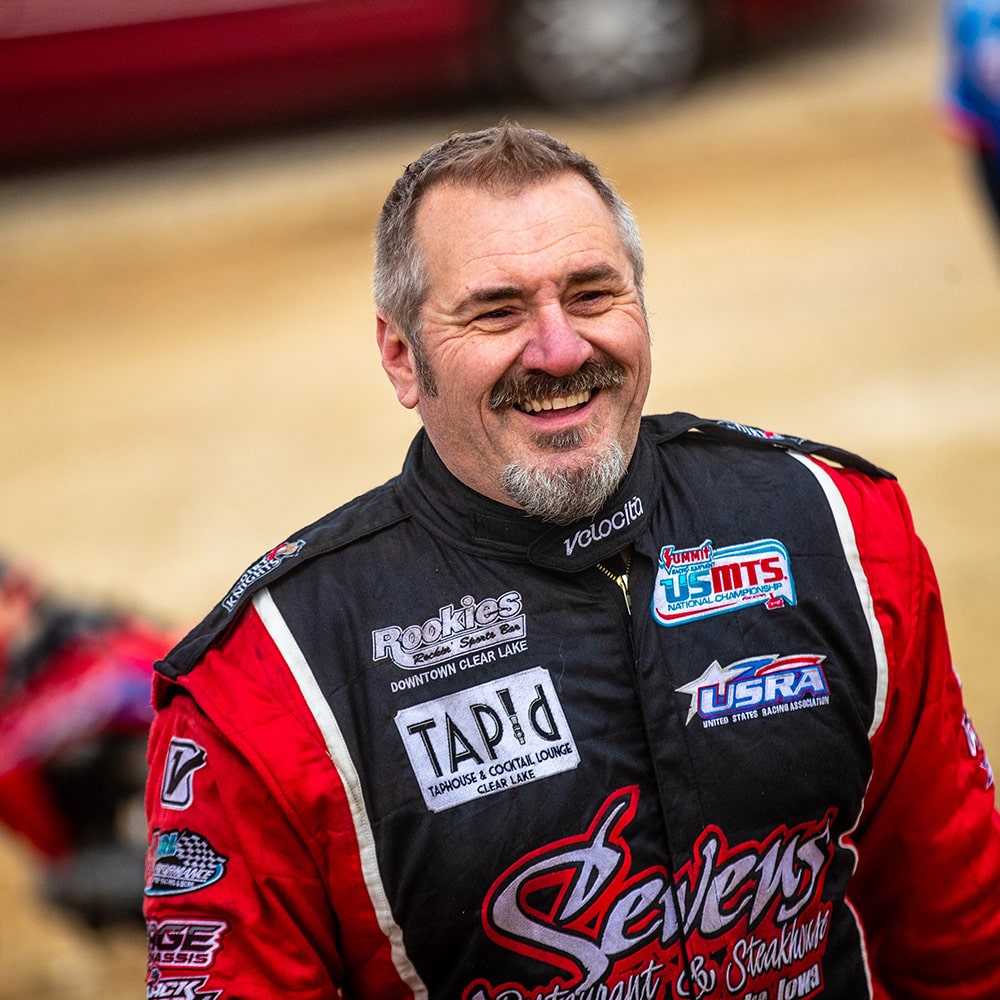 Race Car Driver Smiling in his Race Suit