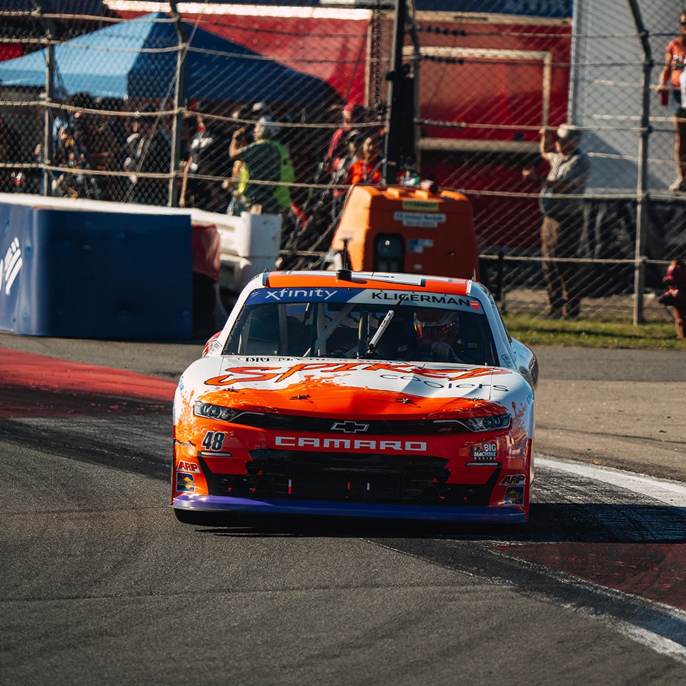 Front View of Race Car Going onto a Track