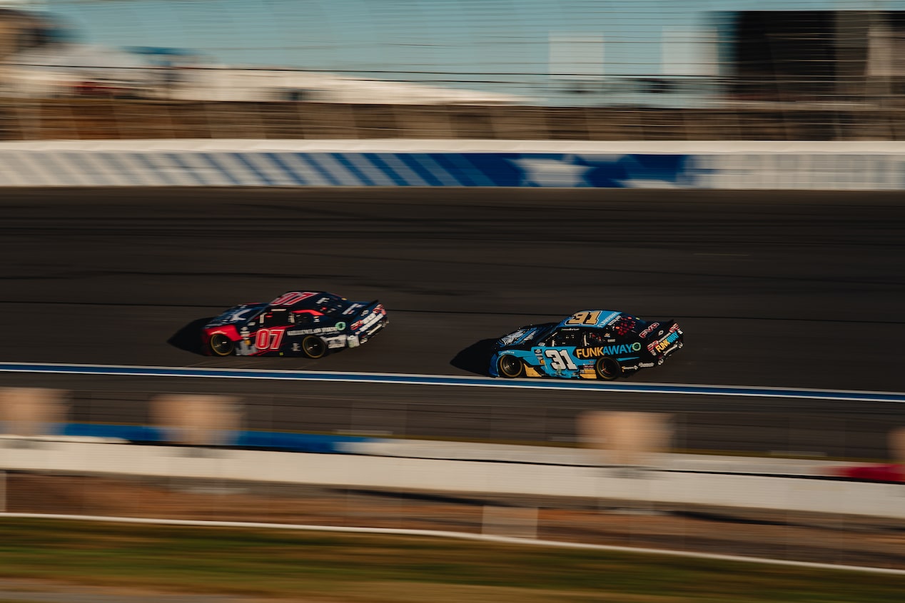 Two Camaro Race Cars on a Track