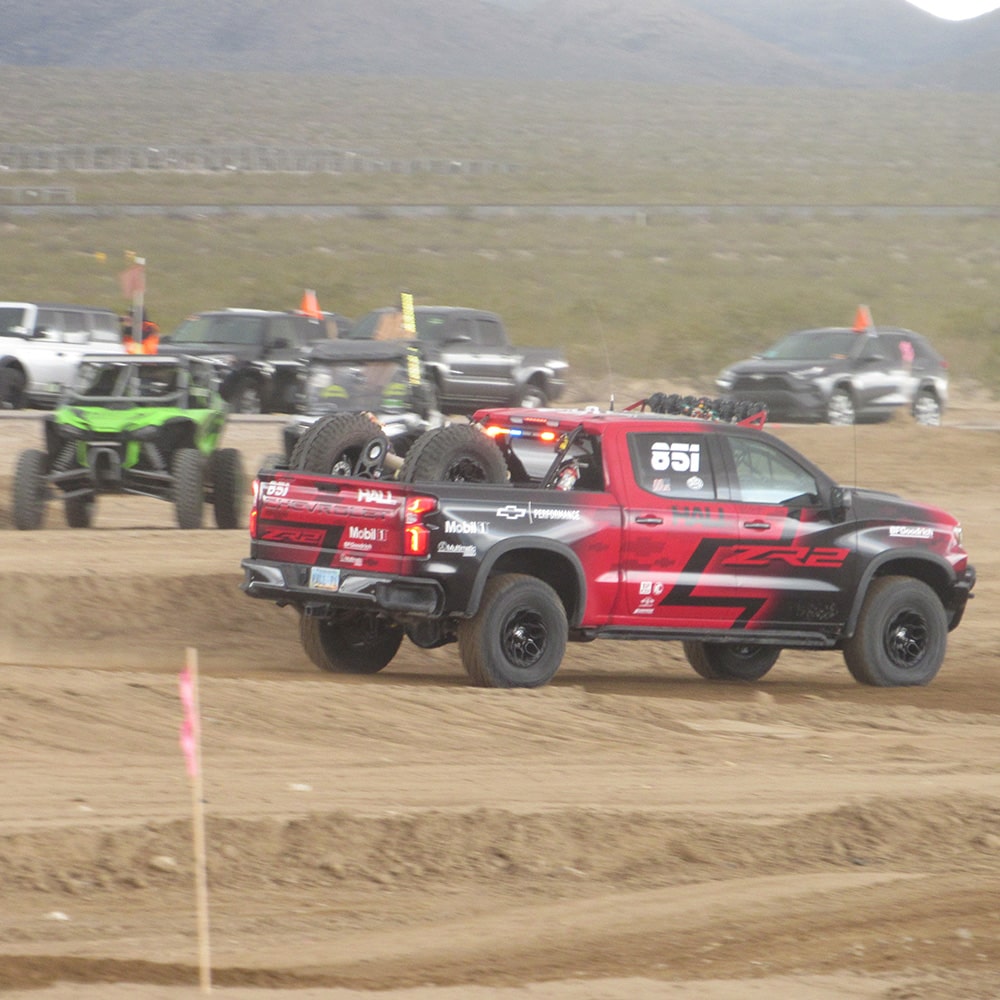 A Group of Off-Roading Trucks in the Desert