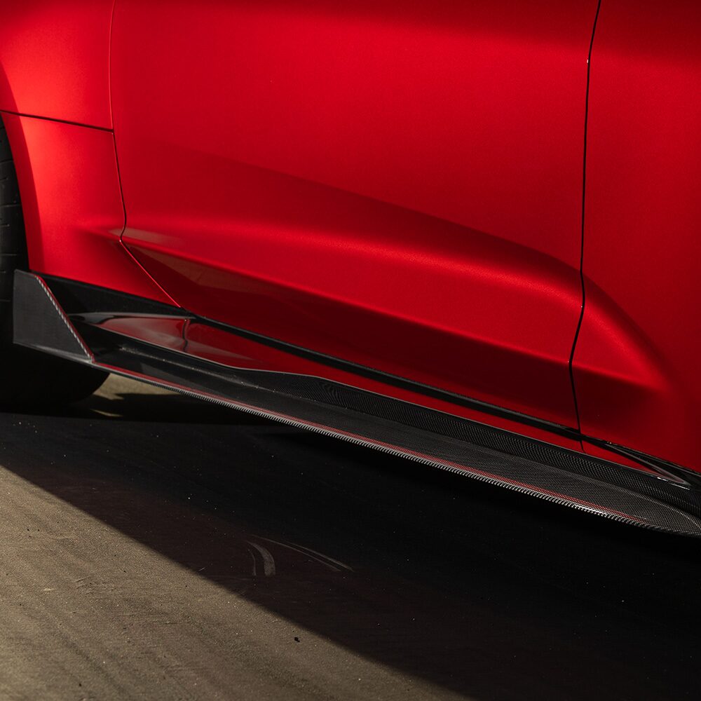 Close-up of the Red Chevrolet Vehicle Side Door and Lower Body