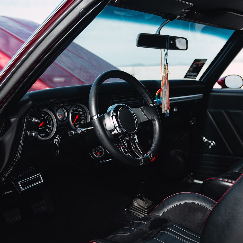 Driver's Side View of Vintage Chevy Vehicle with the Door Open and the Hood Open