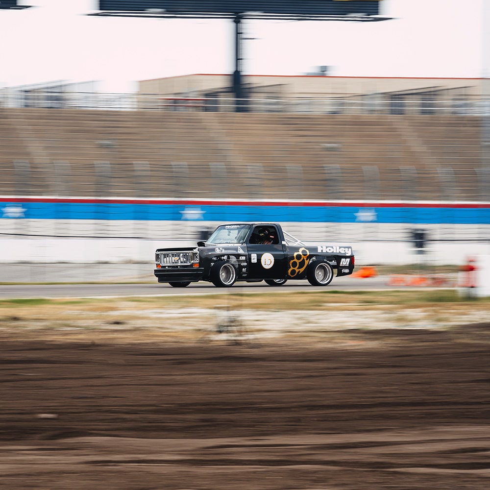 A 1987 Chevy R10 Racing on a Track