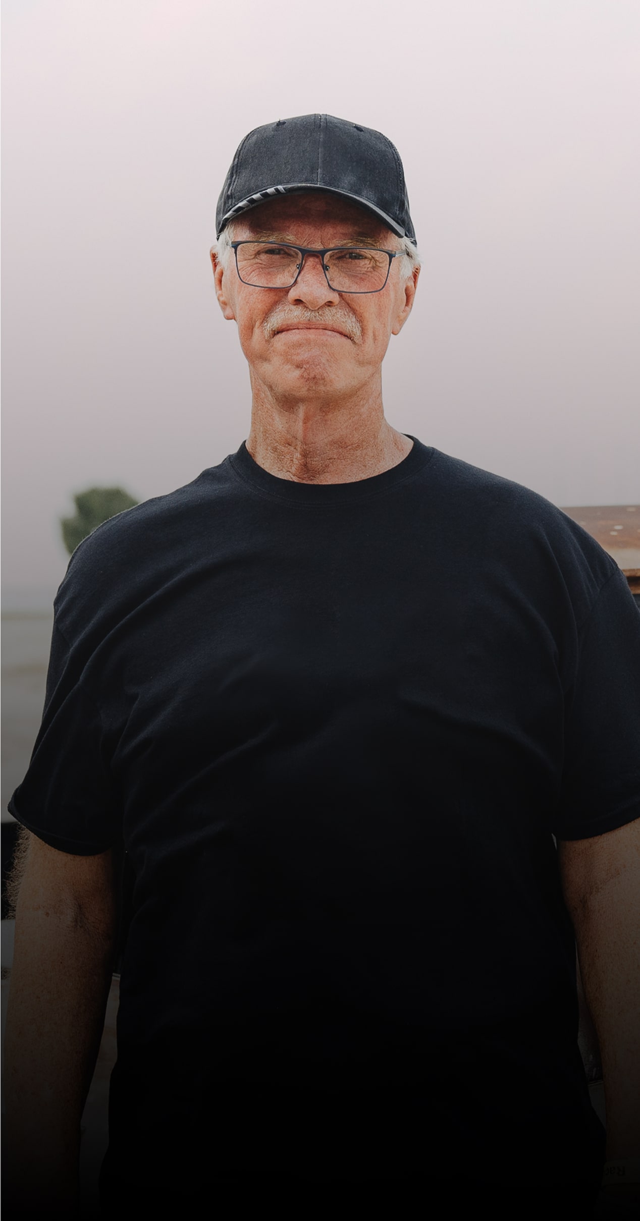 Dwight Ward Faces the Camera while Standing Outside