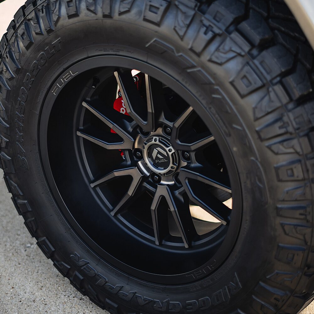 A Close-up View of Nitto 37-Inch-Tall Off-Road Tires that are Mounted on a 1958 Chevrolet Apache Pickup Truck.