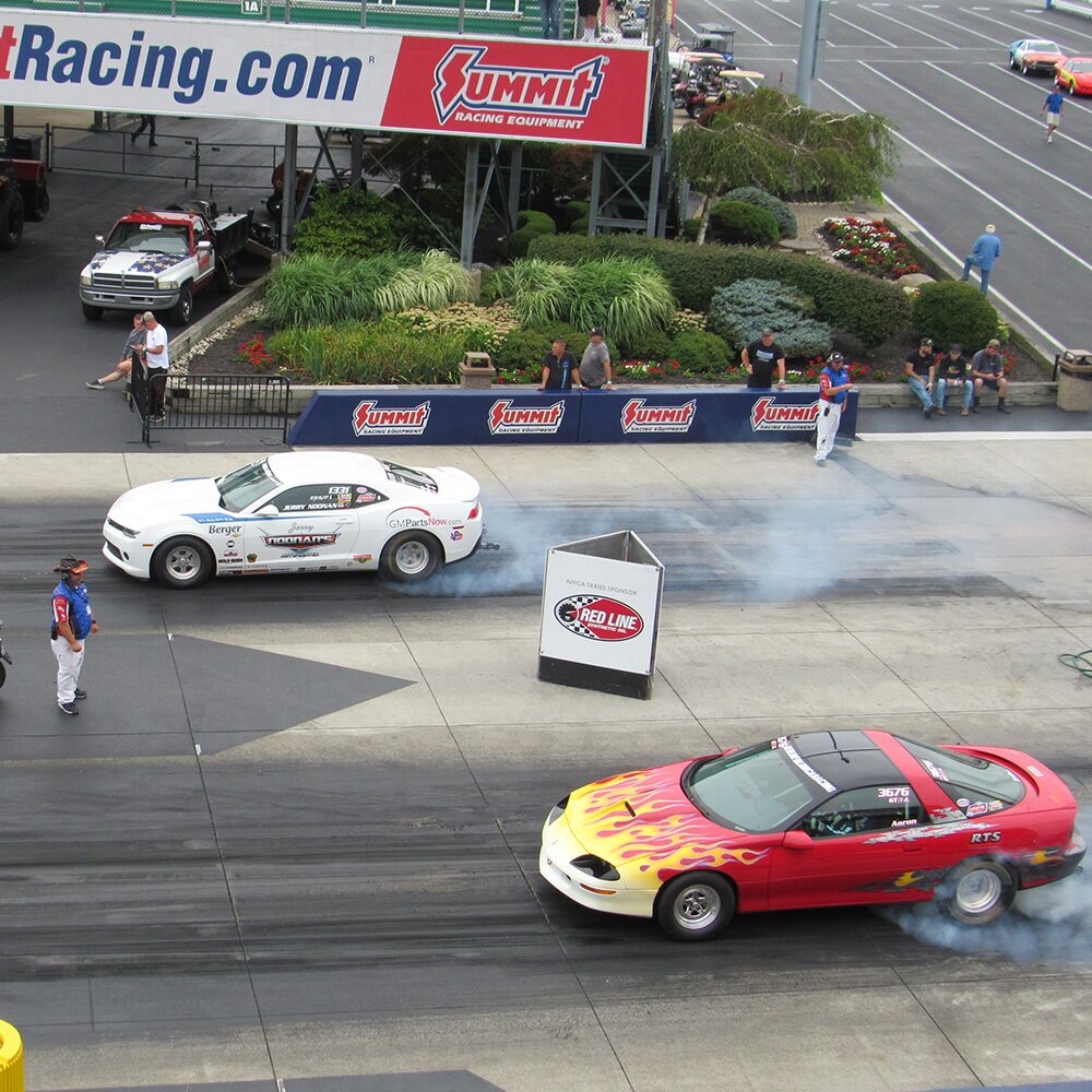 Two Racing Vehicles on a Race Track