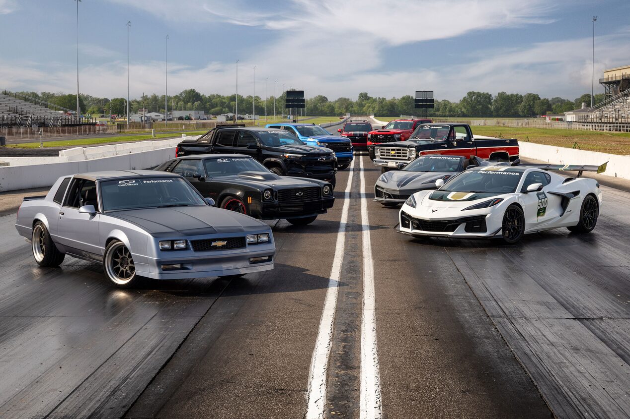 Two Rows of Chevy Vehicles on a Racing Track
