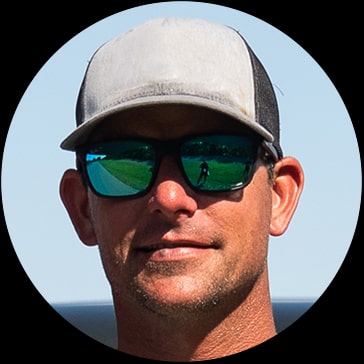 A Close-up Photo of Talbert Goldman Wearing Shades and a Baseball Cap