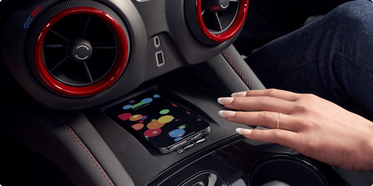 Woman Using Wireless Smart Phone Charging Inside the 2026 Chevy Blazer