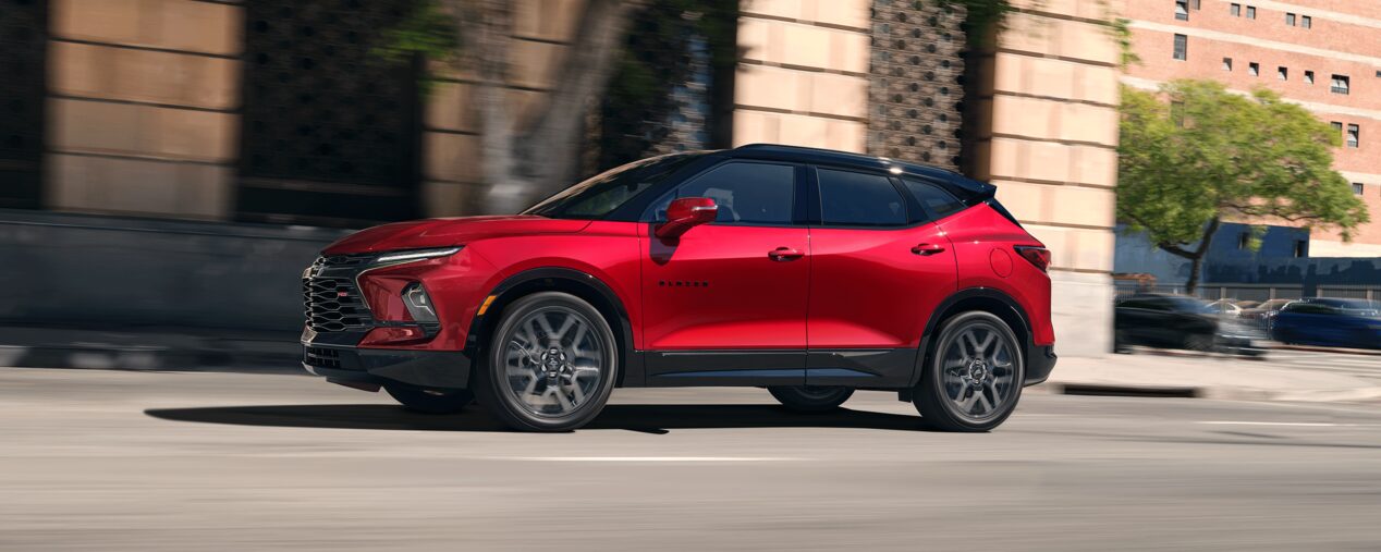 Red 2026 Chevy Blazer Driving Passed Store Fronts