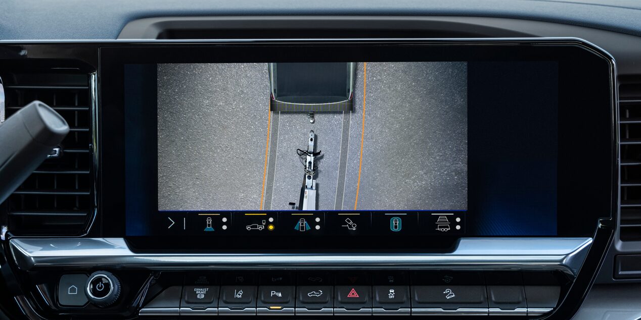 The Rearview Camera Display Inside a Chevy Silverado LD Showing a Hitch View for Trailer Alignment on the Dashboard Screen.