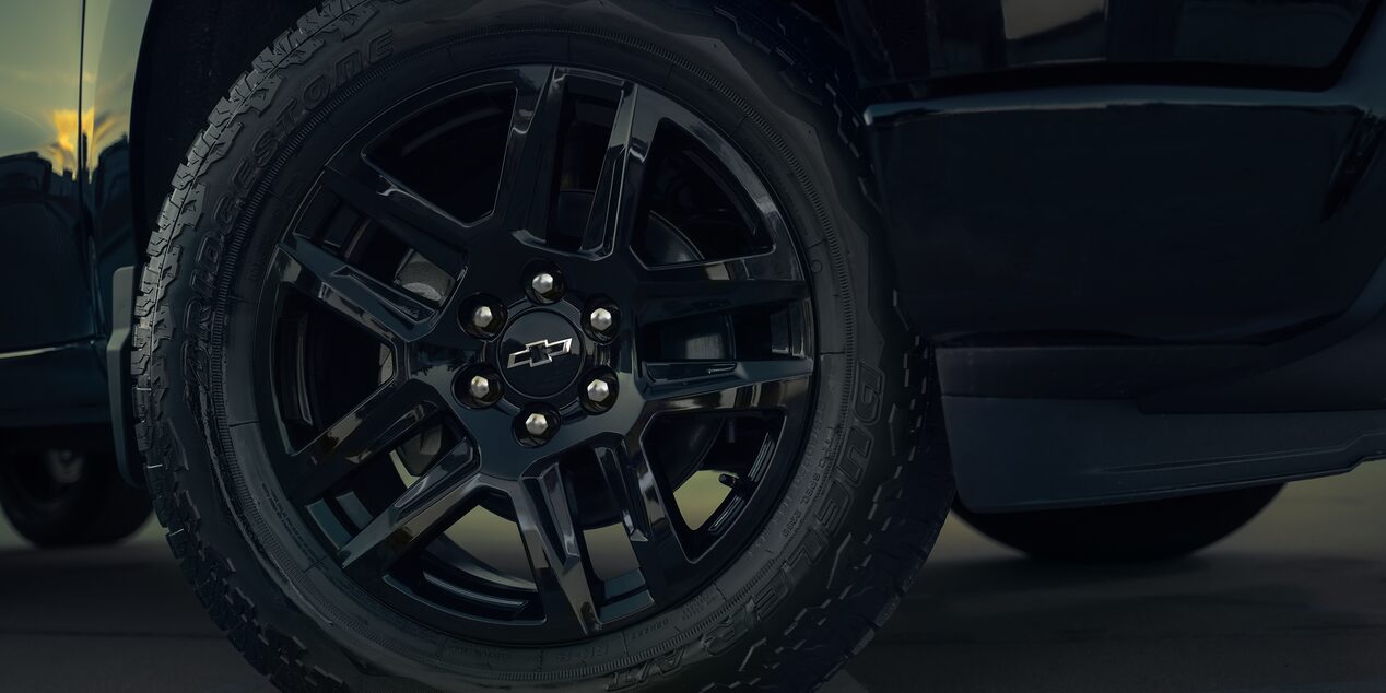 Close-up View of the Tire and Black Rim on a Chevy Silverado 1500 Truck.