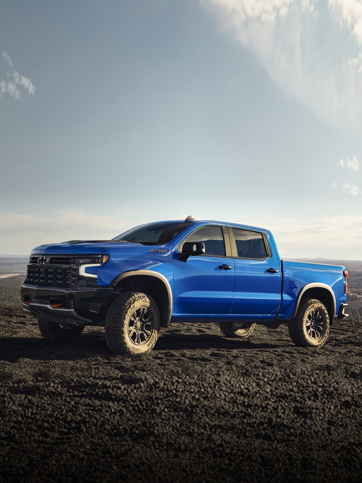 A Blue Chevy Silverado 1500 Parked on a Dirt Hill.