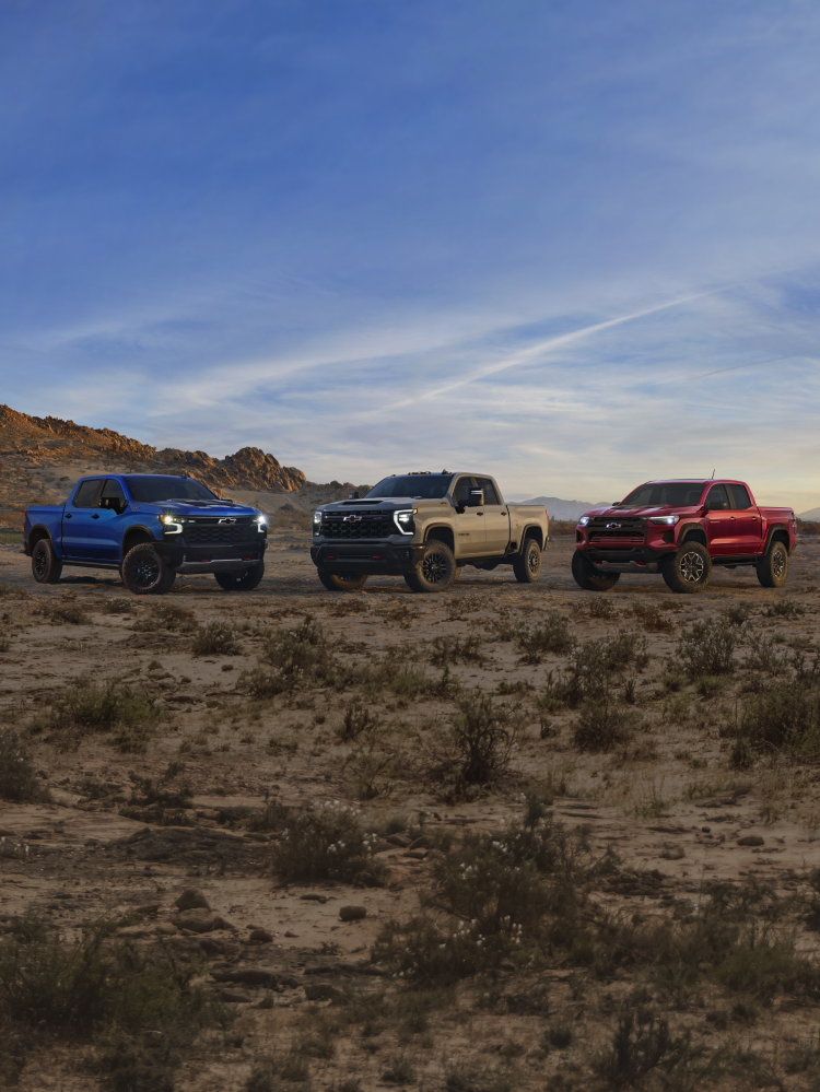Chevy ZR2 Trucks Driving Up a Mountain