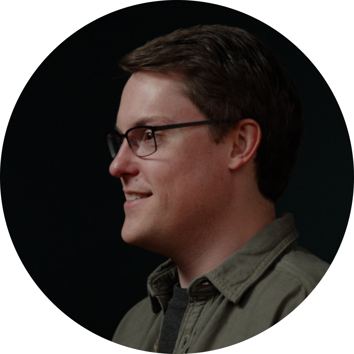 Man with Glasses Looking off to the Side