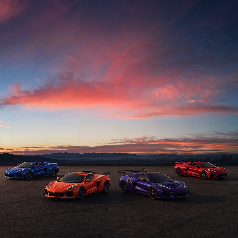 Corvette Lineup at Dusk With Mountains in the Background