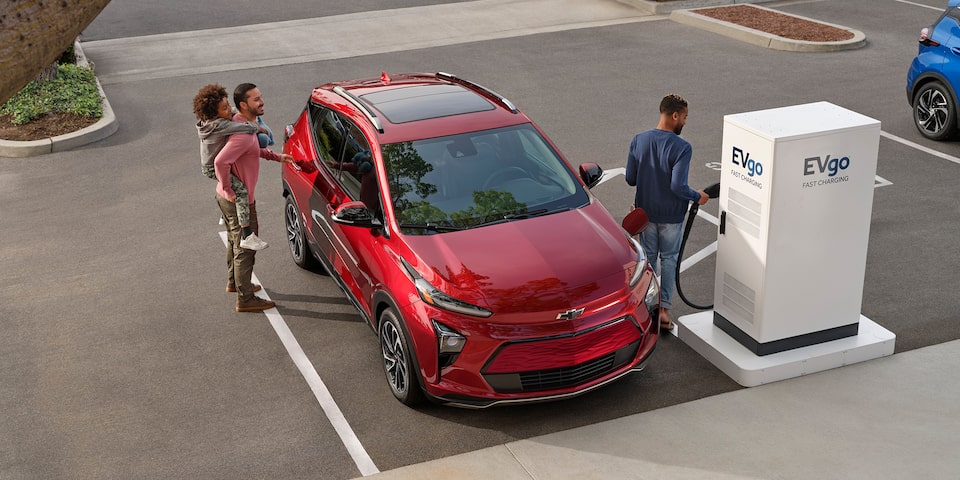 A Family Charging their Chevy Bolt EUV at a Public Charging Station