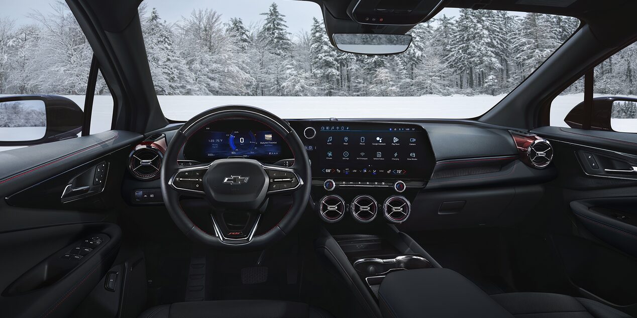 Interior Dashboard View Inside a Chevy Blazer EV with a View of the Snowy Landscape Outside