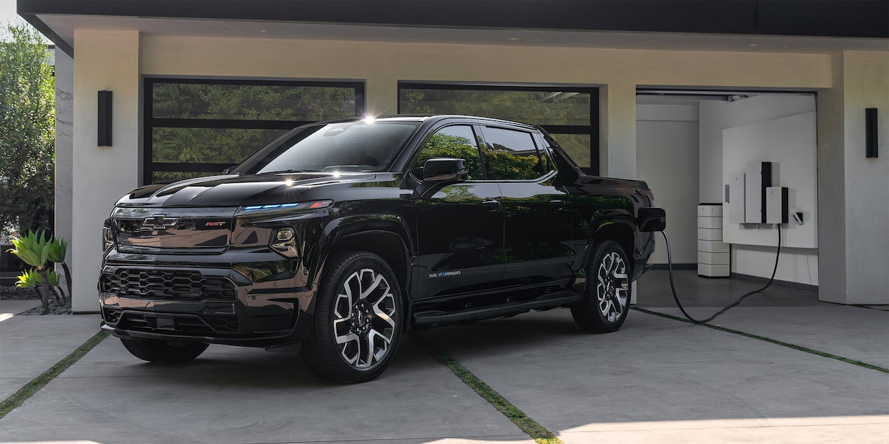 Chevy Silver EV charging in garage