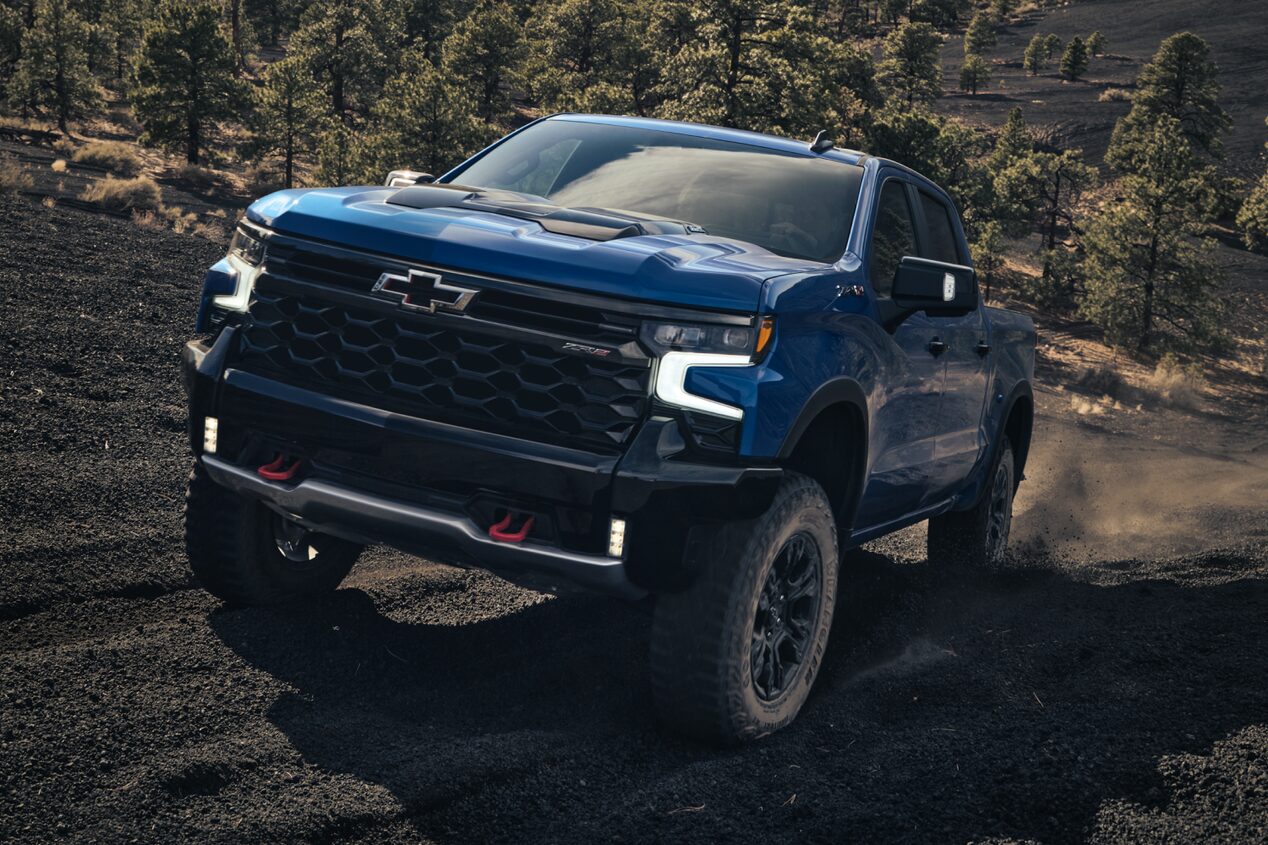 Font Shot of Blue Silverado ZR2 Driving Quickly on Off-Road Terrain