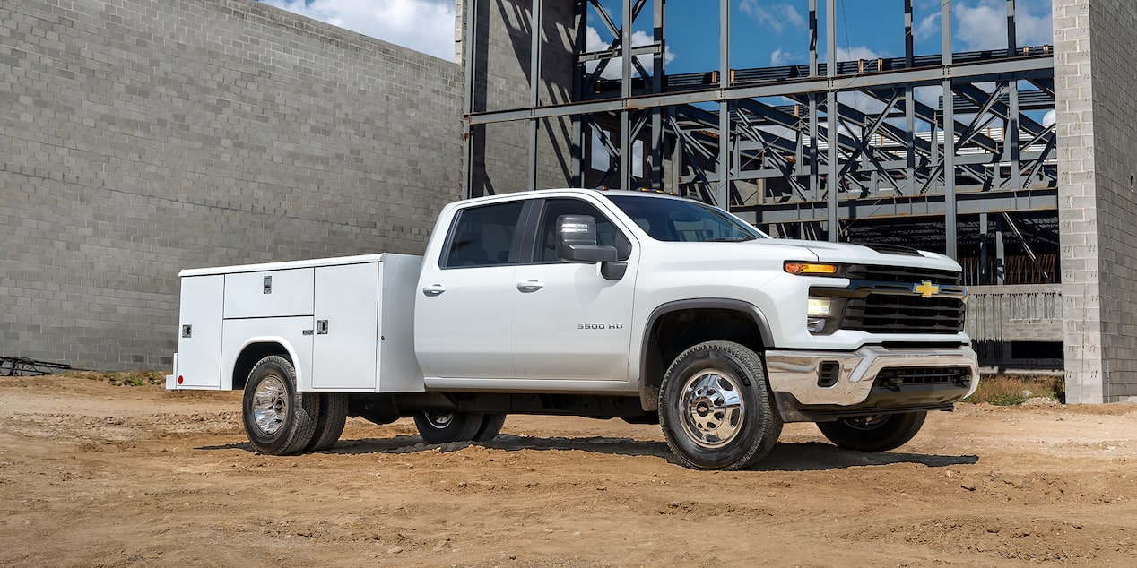 2025 Chevy Silverado 3500 HD Chassis Cab With a Utility Bed Parked at a Construction Site
