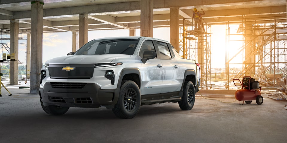 Three quarters view of a Chevy Silverado EV with sunlight coming from behind