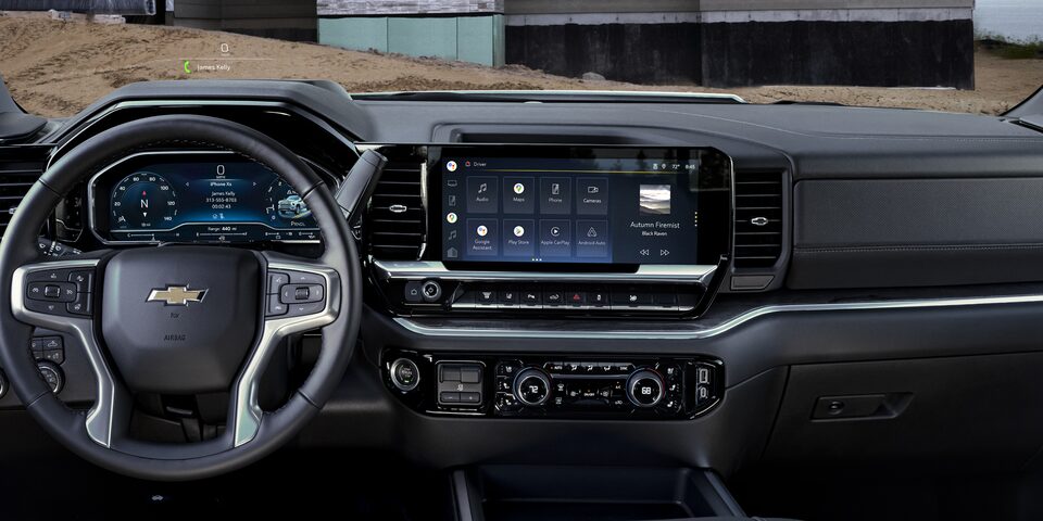 Full View of the Front Interior of 2025 Chevy Silverado HD in Front of a House