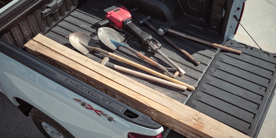 Shovels and Other Various Tools in the Bed of a Truck