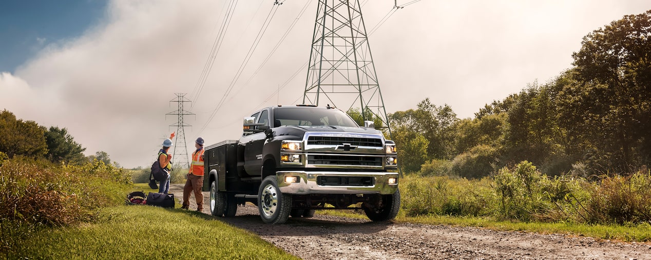 2025 Chevy Silverado Medium Duty Chassis Cab Parked Near Electrical Lines Needing Inspection