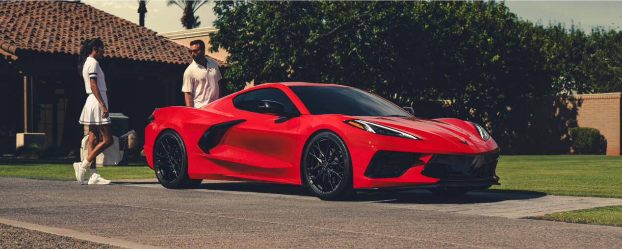 Couple Walking Up to a Parked 2025 Corvette Stingray