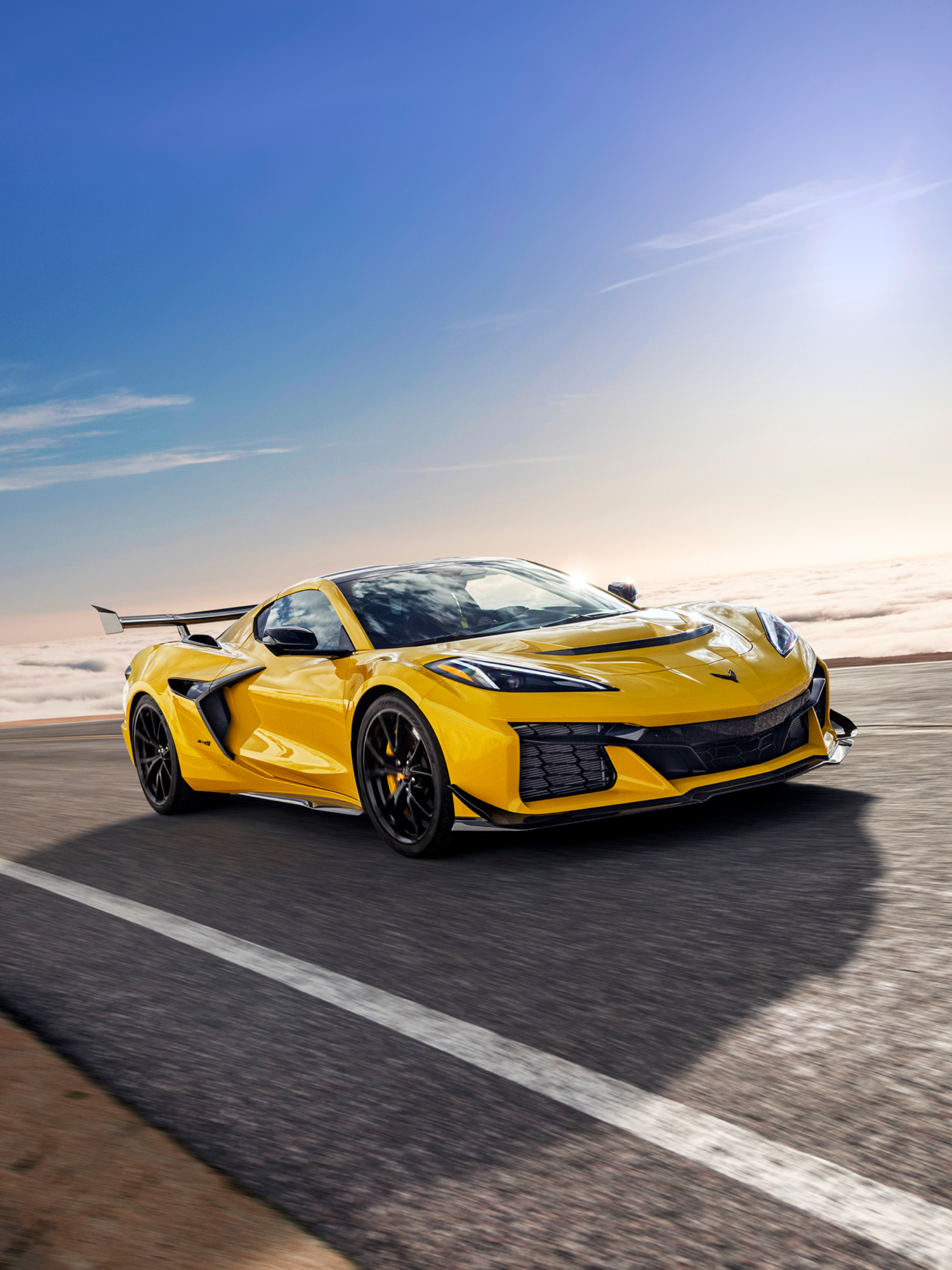 2025 Chevy Corvette ZR1 Speeding Down an Open Road on a Sunny Day