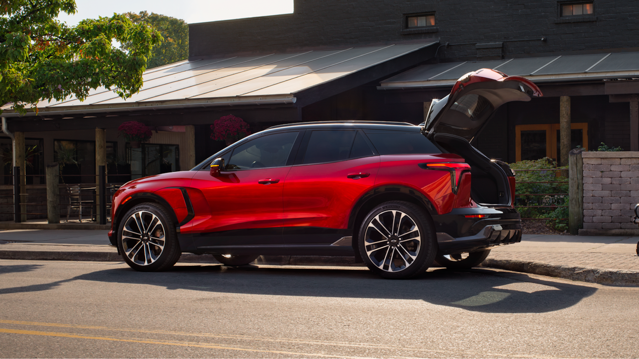 Side View of a Red 2025 Chevy Blazer EV with the Tailgate Open