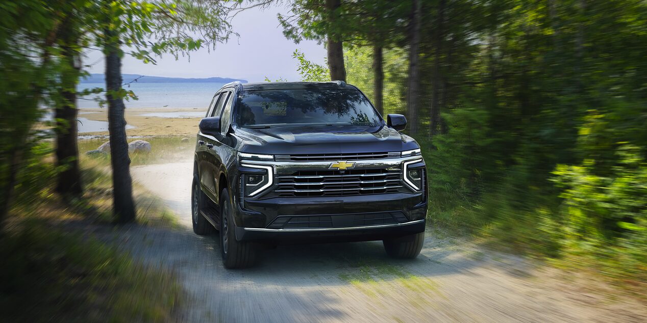 2025 Chevy Tahoe Driving on a Gravel Road Near a Lake